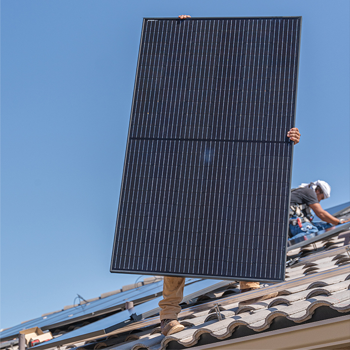 solar pros workers installing solar panels on a roof that enhances solar panel efficiency