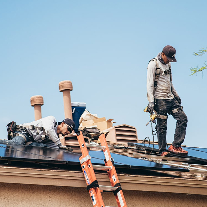 solar pros workers installing solar panels after solar tax credits and incentives