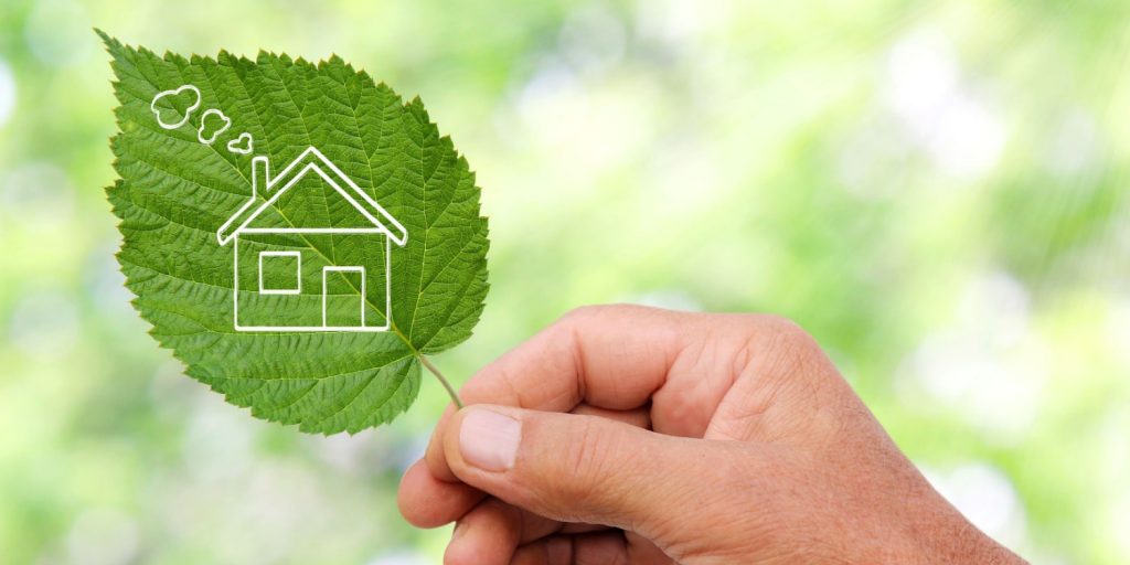 A home graphic on a leaf, representing energy efficiency