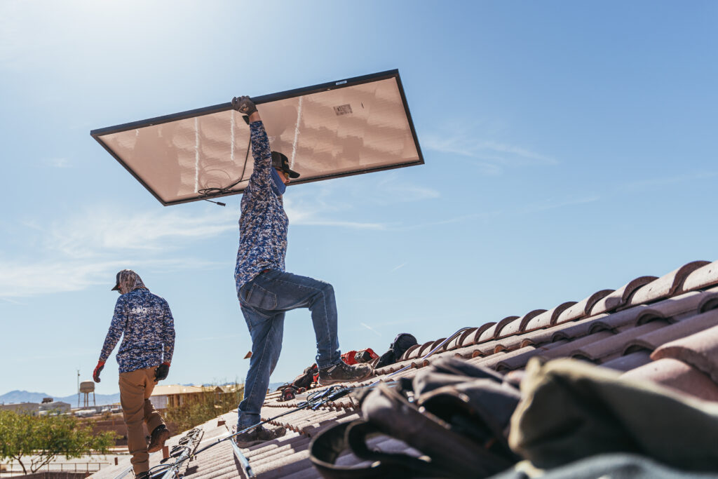 solar pros technicians installing solar panels before summer