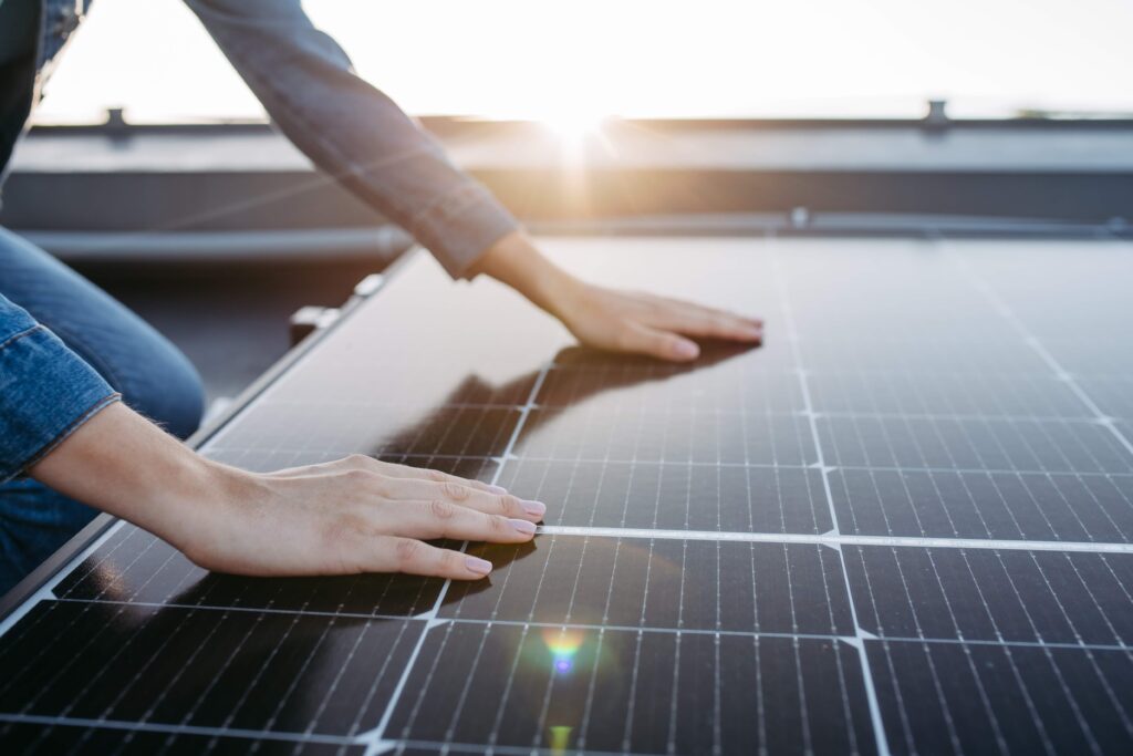 a woman touching solar panel for solar energy in tucson